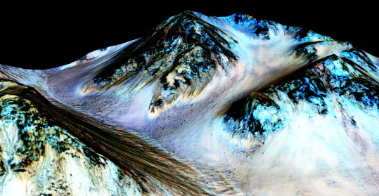 Water flowing on Mars. Site: Hale crater, Mars. Dark brown: a hundred meters long & few meters wide streaks of hydrated salts. Credits: NASA/JPL/University of Arizona